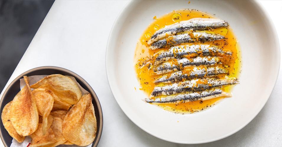 Boquerones · Pickled white anchovies, orange, olive oil, black pepper, chips