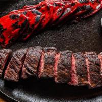 Carne a la Plancha · Grilled 12oz hanger steak, confit piquillo peppers, pimentón butter. 