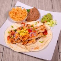 Chicken Fajitas · Grilled peppers tomatoes and onions. Served with guacamole, sour cream, grated cheese, rice,...