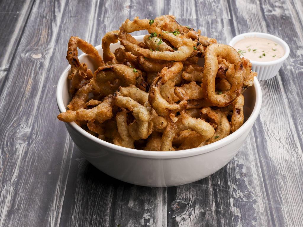 Onion Rings · Beer battered onion rings served with BBQ ranch dressing and Thai chili sauce.