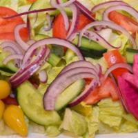 30. Garden Salad · Served with lettuce, tomatoes, cucumbers, red onions and home-made balsamic vinegar dressing.