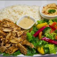 7. Chicken Shawarma Plate · Shredded chicken served with hummus, salad, tahini sauce, turnips and pita bread.