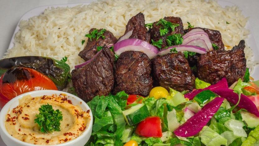 10. Beef Shish Kabob Plate · Marinated beef served with hummus, rice, salad, onion and pita bread.