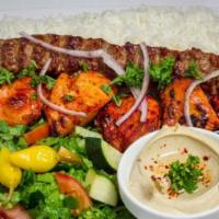 12. Combo Kabob Plate · Chicken breast and beef lula served with hummus, rice, salad,onion and pita bread.