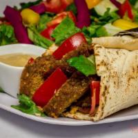 20. Falafel Wrap · Served with salad and tahini sauce.