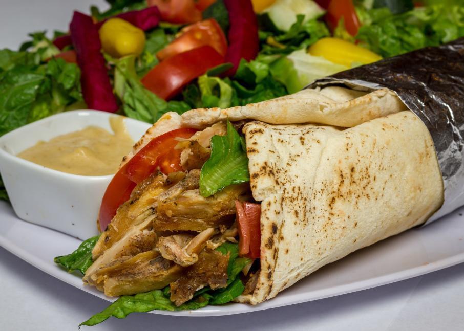 22. Chicken Shawarma Wrap · Served with salad and garlic sauce.