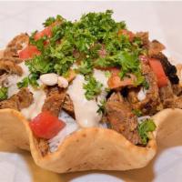 27. Rotisserie Chicken Bowl · Served with toasted garlic pita, parsley, tomatoes and tahini sauce.