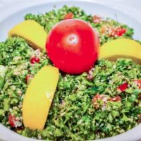 40. Tabbouleh 8 oz · Chopped tomatoes, minced parsley, cilantro, mint, and green onions mixed with wheat lemon an...
