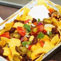 Jimmy Nachos · Zesty ground beef topped with nacho cheese sauce, sour cream, salsa and jalapenos.