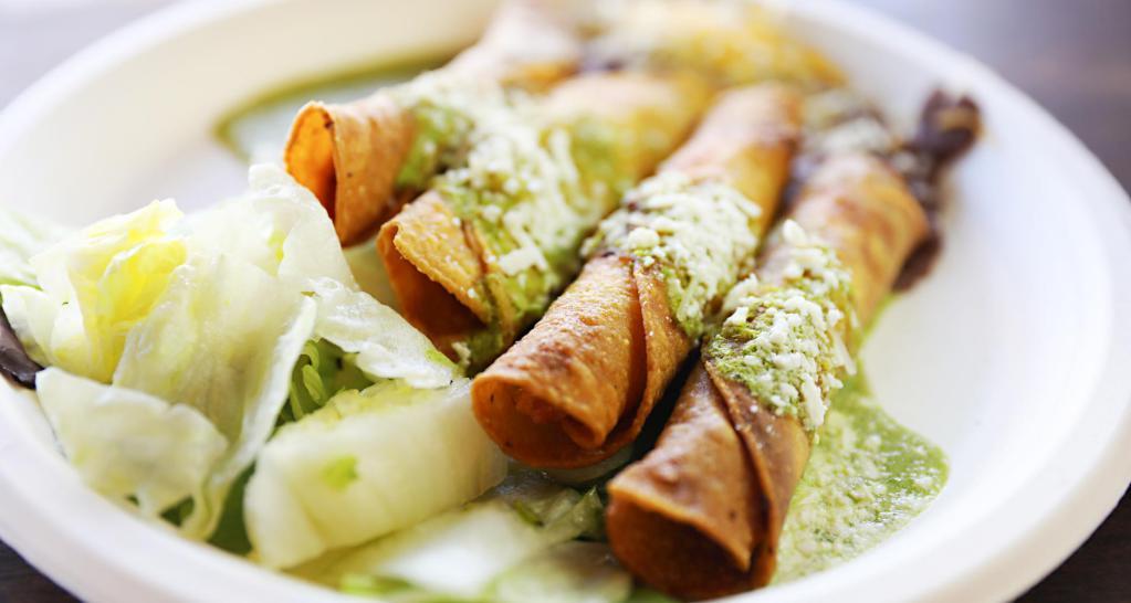 Rolled Taquitos · Choice of protein. Crispy rolled taquitos with our 51/50 vegetarian beans, tomatillo sauce and topped with Cotija cheese.