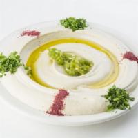 Hummus · Small includes with 1 pita and large includes with 2 pitas.