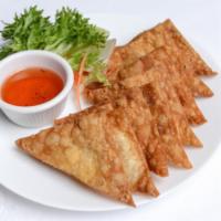 2. Fried Wontons · 10 pieces. Fried wontons stuffed with ground chicken served with sweet and sour sauce.