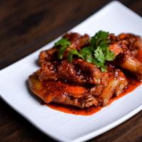 19. Thai Wings · Deep fried wings mixed with spicy sweet and sour sauce. Hot and spicy.