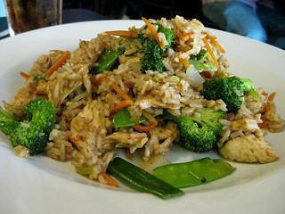 Vegetable Fried Rice · Stir-fried rice with egg, onions, scallions, tomatoes and mixed seasonal vegetables.