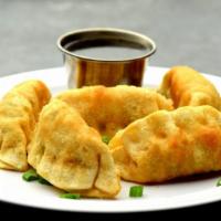 Crispy Potsticker · 5 pieces. Japanese pork gyoza with dipping sauce.