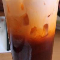 Thai Tea · Thai Tea is made from strongly brewed Ceylon tea with a touch of half and half served over i...