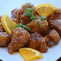 Orange Chicken · Carrots and tangy orange spicy sauce.