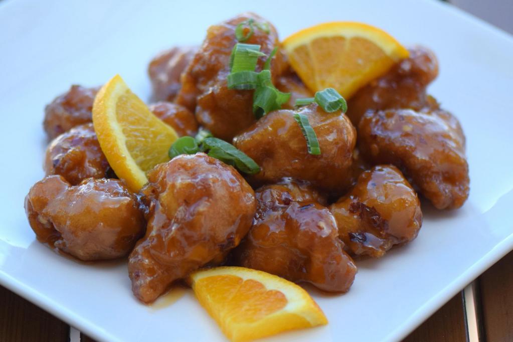 Orange Chicken · Carrots and tangy orange spicy sauce.