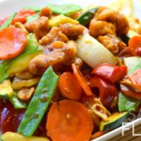 Kung Pao Chicken · Diced chicken, snow peas, carrots, zucchini, peanuts and spicy kung pao sauce.