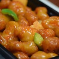 Sweet and Sour Chicken · Green and red pepper, onions, and pineapple.