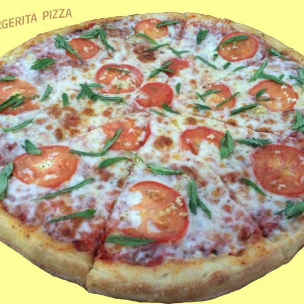 Margherita Specialty Pizza · Olive oil, basil, fresh garlic and sliced tomatoes.