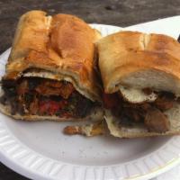Torta Azteca · Steak, sauteed peppers, onions, nopales, lettuce and jalapenos. Includes oaxaca cheese, blac...