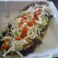 Huarache · Thick sandal shaped corn tortilla with meat of choice. Includes lettuce, cotija cheese, blac...