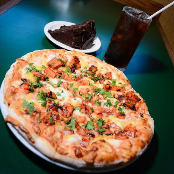 BBQ Chicken Pizza  · Mesquite grilled chicken breast, smoked gouda and mozzarella cheese, red onions, cilantro and our special bbq sauce.