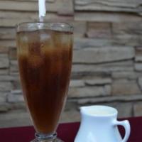 Spiced Iced Tea · Darjeeling tea brewed with fresh mint and spices. Served with sweetened milk on the side.