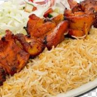 Chicken Kebab and Rice Platter · Pieces of boneless chicken breast marinated in spices, yogurt and olive oil slowly grilled o...