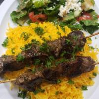 Kaftan-Adana Kebabs Platter · Seasoned ground beef mixed with parsley, onion and spices slowly grilled on a skewer, rice a...