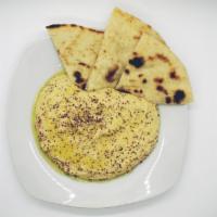 Hummus and Pita · A rich puree of chickpeas, tahini, olive oil, lemon juice, fresh garlic and salt.