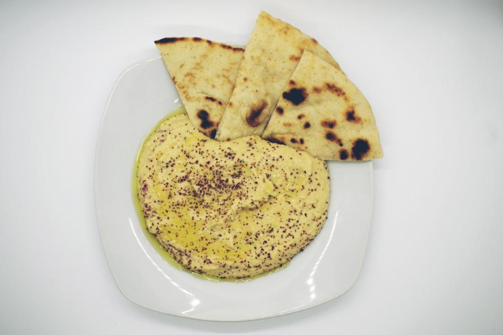 Hummus and Pita · A rich puree of chickpeas, tahini, olive oil, lemon juice, fresh garlic and salt.