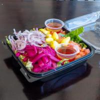 Garden Salad · Romaine lettuce, diced tomatoes, red onions, pickled turnips and yellow chilis, drizzled wit...
