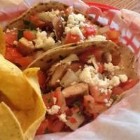 Grilled Chicken Tacos · Two grilled chicken tacos topped with pico de gallo salsa & queso fresco. Served with a rame...