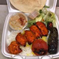 Spicy Chicken Breast Kabob · Spicy Chicken Breast served with Rice or French Fries, Salad, Pita Bread, with your choice o...