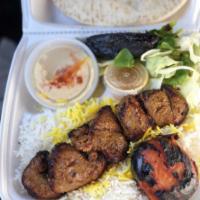 Lamb Kabob Combo Plate · Succulent Lamb meat served with Rice or French Fries, Salad, Pita Bread, with your choice of...