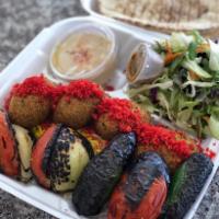 Veggie Delight Combo Plate · 4 Falafels, Skewer of vegetable BBQ served with Rice or French Fries, Salad, Pita Bread, wit...