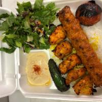 Chicken Soltani · Skewer of Chicken Breast and skewer of Ground Chicken served with Rice or French Fries, Sala...