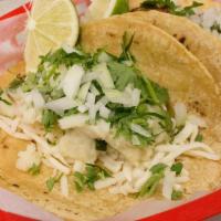 Taco · Corn tortillas you choice of filling with cilantro onions lime and salsa.