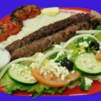 Beef Kebab · Two of our secret recipe beef kebab skewers served with basmati rice and a side Greek salad ...