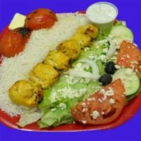 Chicken Kebab · Marinated grilled chicken served with basmati rice and a side Greek salad and tzatziki sauce...