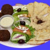 Falafel Platter · Four falafel pieces served with tahini sauce, a side Greek salad, hummus and toasted pita br...