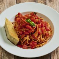 Capellini alla Checca · Angel hair pasta, fresh tomato, garlic, basil with a touch of marinara sauce.