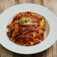 Fettuccine alla Bolognese · House-made fettuccine with Bolognese-styled meat sauce.