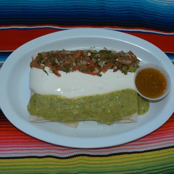 Super Quesadilla · Flour tortilla with melted cheese, meat topped with guacamole, sour cream and pico de gallo salsa.