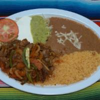 Bistec Ranchero Plate · Grilled steal sauteed with jalapeno peppers, onions, tomato and tomatillo sauce. Served with...