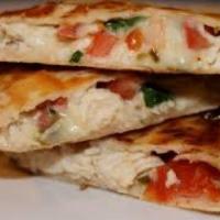 Southwest Chicken Quesadilla · Sauteed Cajun chicken breast, onions, peppers, melted mix blend cheese served in a golden to...