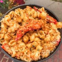 Lobster Mac and Cheese · Lobster meat and cheddar cheese topped with toasted bread crumbs.