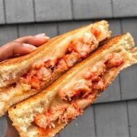 Jack's Lobster Grilled Cheese · Lobster meat and cheddar cheese on Texas toast. Served with homemade coleslaw, pickles and c...